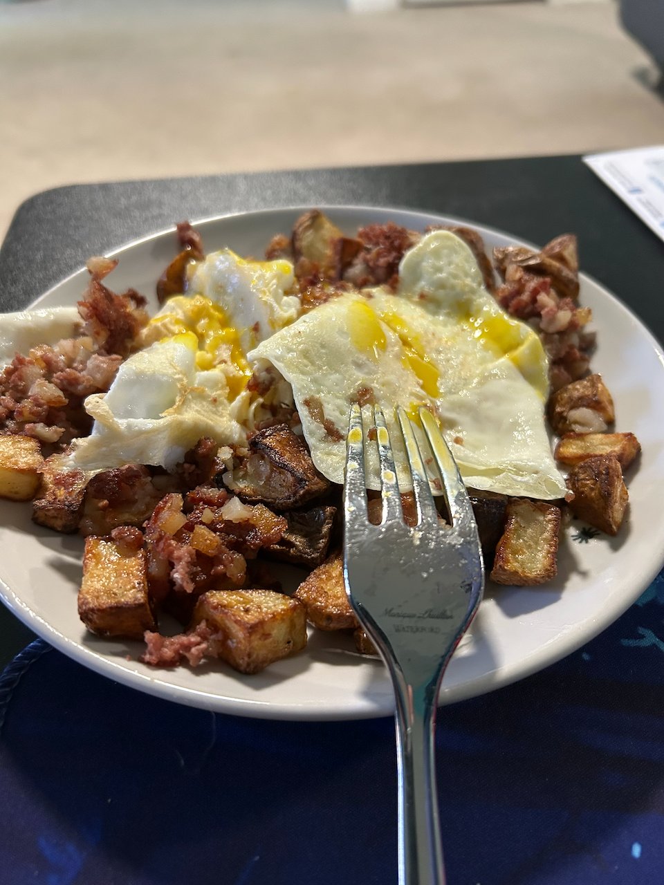 Breakfast skillet with eggs, vegetables, and potatoes